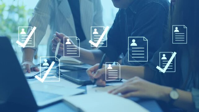 Business recruitment team in a meeting, using technology for candidate selection and employee hiring management.
