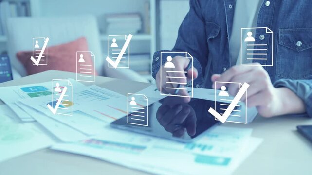 Recruiter using data and technology for candidate selection, screening resumes for a business hiring project.