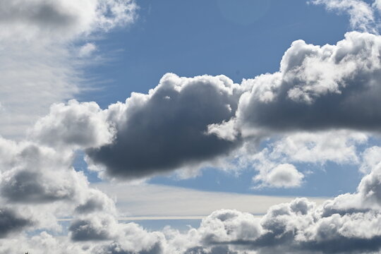 Black and white clouds on a blue sky background, cloud background