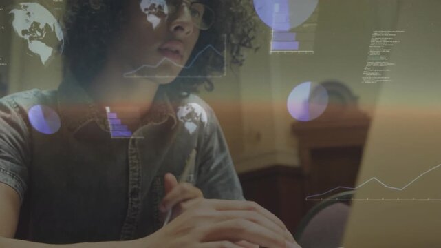 Data analyst fidgeting pen and starting holographic chart overlay while typing and analyzing trends