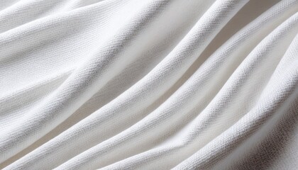 Close-up of flowing, textured white fabric with soft folds