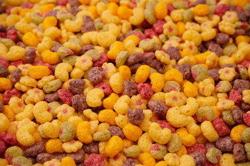 Sweet crunchy cornflakes as a background. Top view.