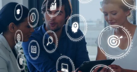 3 colleagues tapping tablet and generating floating business icons showing collaborative strategy - Powered by Adobe