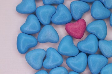 A pink heart among blue ones: a visual metaphor for uniqueness, tenderness, and the courage to be yourself in a homogeneous world