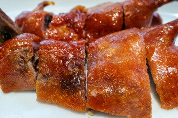 Close-up of roasted goose. Chinese popular cuisine. Chinese food culture. Food and beverage concept.