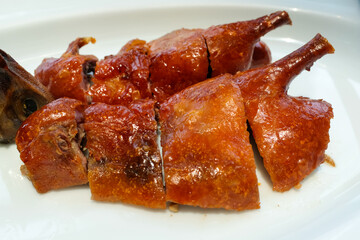 Close-up of roasted goose. Chinese popular cuisine. Chinese food culture. Food and beverage concept.