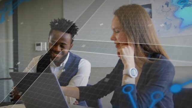 Woman tapping laptop key initiating data analysis with map overlay at table and sharing smiles