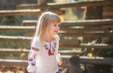 Girl Enjoying the Beauty of Autumn During a Playful Day Outdoors in a Scenic Park in October, Celebrating Halloween With Vibrant Fall Colors