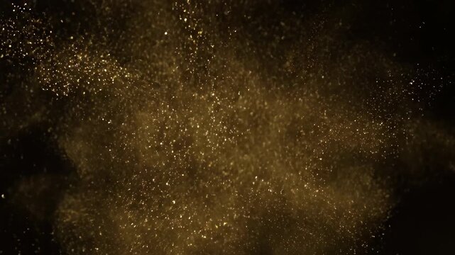 Fine gold dust particles gracefully swirl and dance in zero gravity, creating a soft, elegant and captivating slow-motion pattern space, design element, overlay