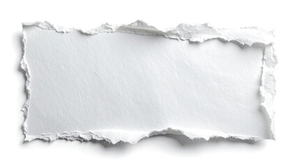 Close-up view of a torn rectangular piece of white paper with rough edges