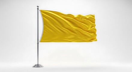 A bright yellow flag waving gently on a silver flagpole isolated on white background
