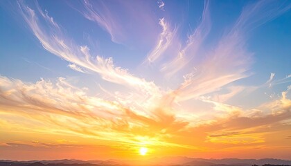 Fototapeta premium Stunning sunset over a landscape, vibrant sky with streaks of color