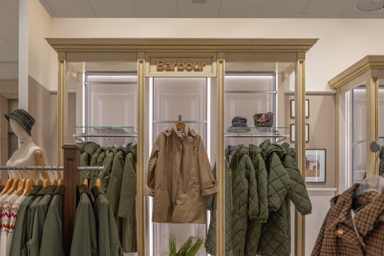 Germany Berlin October 7, 2025. Barbour section with classic coats and quilted jackets. Elegant retail display featuring timeless outdoor fashion.