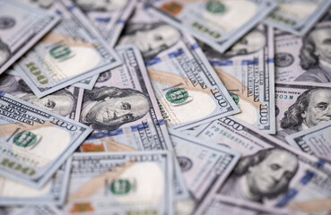 Money background with 100-dollar bills. Texture of US money currency. 100 USD banknotes in focus. American hundred-dollar money for banner. Pattern of US dollars. Money for finance concept.