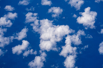 Dreamy cloudscape above. Sky with white clouds. Sky background design. Many clouds. Puffy cumulus...