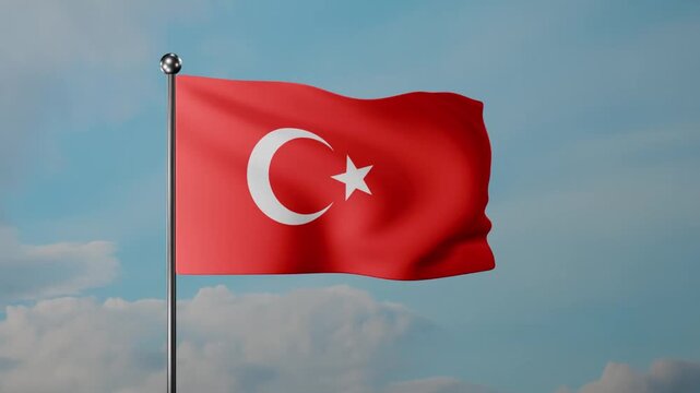A waving Turkish flag on a tall pole against a clear blue sky. Red background and white crescent with star symbolize patriotism, unity, and national pride.
