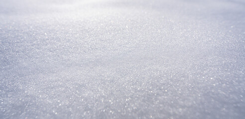 Obraz premium Snow covers the background. Snow shows the beauty of winter. Snow looks bright and white. Snow stays frozen all day. Snowy pattern. Snowflake falls. Cold and icy background.