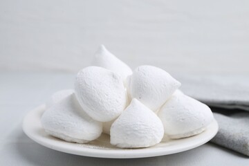 Delicious meringue cookies on white table, closeup © New Africa