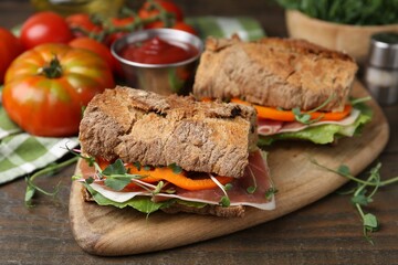 Tasty ciabatta sandwiches served on wooden table, closeup