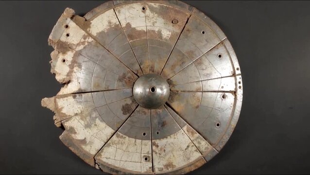Ancient Bronze Age Shield: An evocative view of the Nebra Sky Disc, a bronze artifact dating back to the Bronze Age. Crafted from metal.