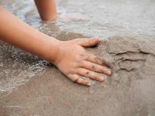 Child Playing with Sand on Beach – Summer Vacation Fun