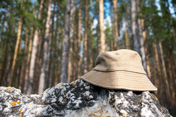 The cloth hat in the foreground is on a stone