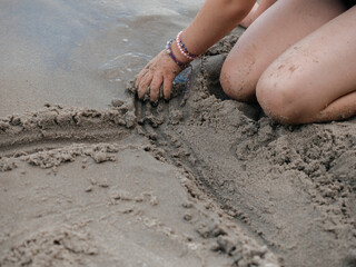 Child Playing with Sand on Beach – Summer Vacation Fun