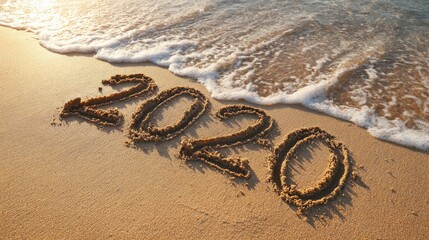 2021 and 2020 inscription written in the wet beach sand with sea water wave no logos no brands ar 169