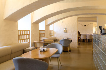 Stylish and Modern Cafe Interior featuring Beautiful Arched Ceilings and Comfortable, Cozy Seating
