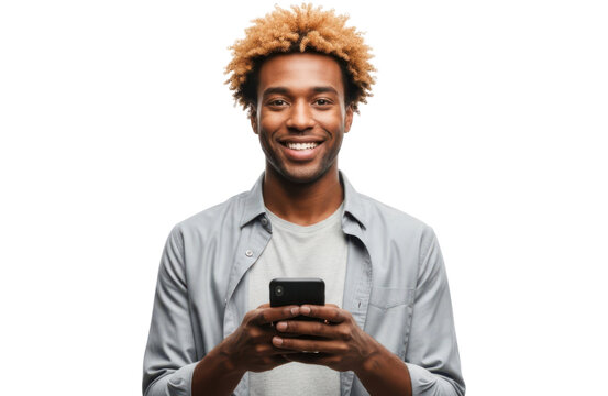 A smiling african american man with curly hair, wearing a grey shirt, holding and looking at a smartphone, isolated on transparent background