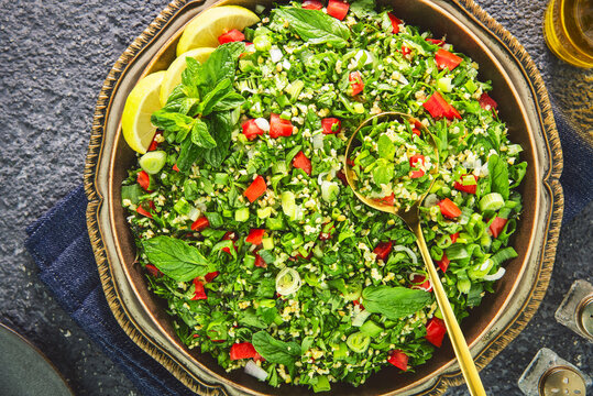 Arabic Cuisine; Middle Eastern traditional Tabbouleh salad of finely chopped parsley, tomatoes, mint, onion and bulgur wheat. All tossed with lime juice and olive oil.