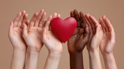 Hands reaching together with symbolic red heart shape, concept of collective donation and kindness for Giving Tuesday support