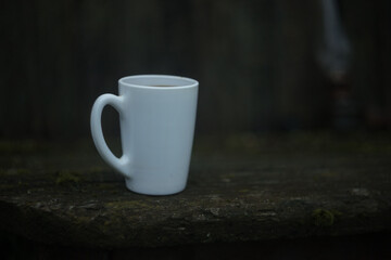 cup of coffee on wooden table