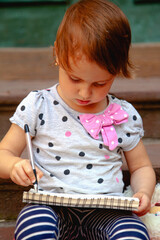 Child focused on creating her first business plan.