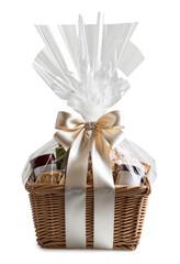 Gift basket wrapped in transparent cellophane with a satin bow