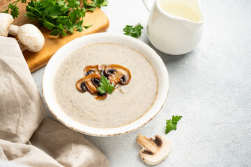 Mushroom soup puree on white kitchen table.