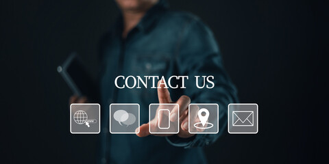 businessman touch with virtual contact icons including phone,email,chat,location,and web links under the text CONTACT US, symbolizing communication, customer service support,and digital connectivity.