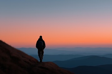 Obraz premium Solitary hiker at sunrise on mountain ridge in serene landscape