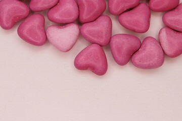 Obraz premium A light pink heart among pink ones: a symbol of tenderness, choice, and emotional uniqueness
