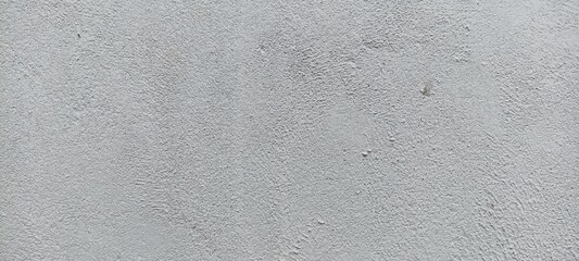 Rough White Plaster Wall Texture Background. Close-up of rough white plaster wall showing uneven surface and fine texture, ideal for backgrounds or design mockups