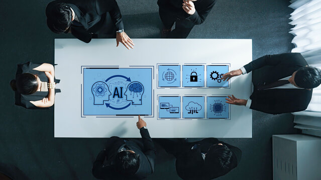 A diverse business team engages in a discussion about artificial intelligence strategies illustrated with digital icons on a sleek office table. Trope