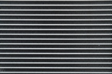 Close-up of the honeycomb texture of an aluminum car radiator