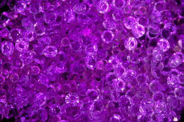 Fototapeta premium Bright festive background. Purple crystals on a dark background.