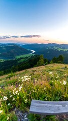 Panoramic vista from a hillside overlooking a valley at sunrise