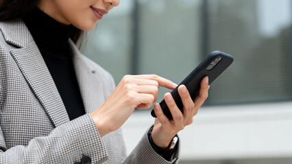 Woman using smartphone outdoors