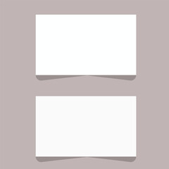 Two blank white rectangular cards on a light purple background
