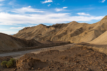 Dirt Road Beside Eroded Hills Under Deep Blue Sky, 20 Mule Team Canyon, Death Valley National Park