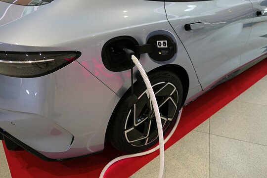 Charging port with charging cable connected on modern chinese battery electric mid sized sedan BYD Seal, displayed on car expo iin Bory Mall, Bratislava, september 2025.  