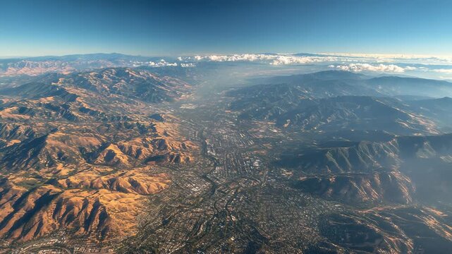 Aerial View of San Jose, California, USA, nestled between the Santa Cruz Mountains and the Diablo Range on a clear day.