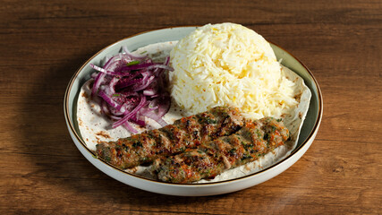 Lula kebab with rice and lavash on plate